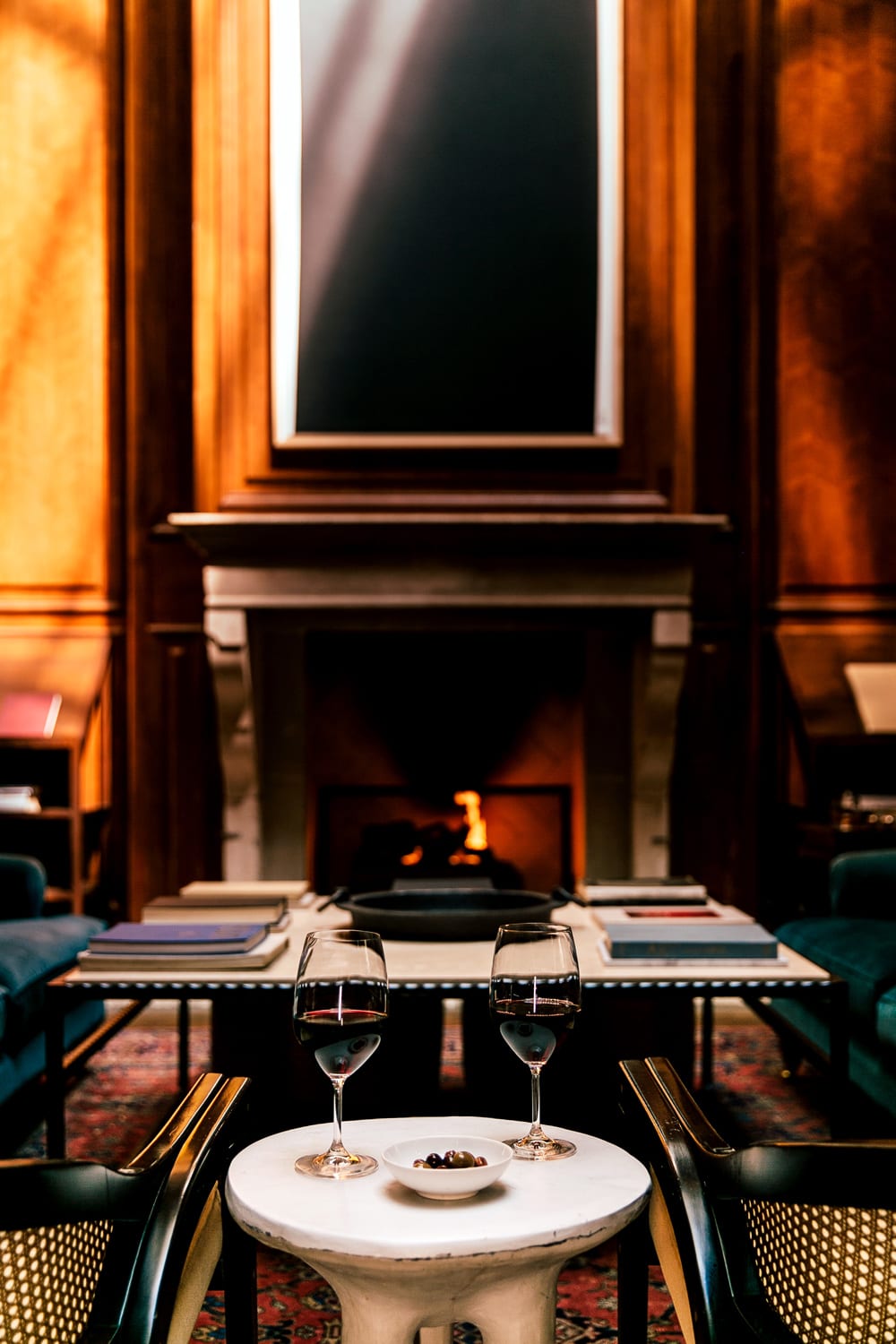 fireplace and table with wine glasses